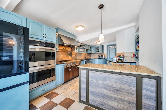 24 Raynor St, West Babylon, NY 11704 - kitchen with double oven, blue cabinets, cooktop, decorative backsplash, and a sink