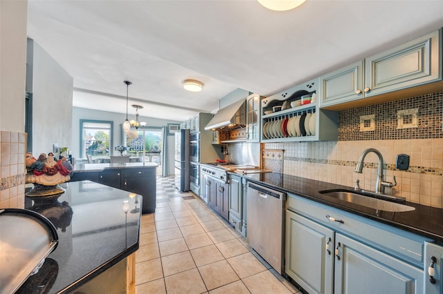 24 Raynor St, West Babylon, NY 11704 - kitchen with a sink, stainless steel appliances, tasteful backsplash, and wall chimney range hood