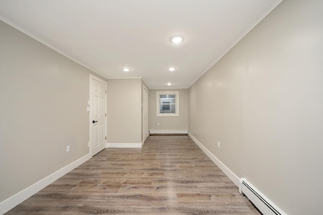 12 Barberry Ln, Middle Island, NY 11953 - empty room featuring a baseboard radiator, ornamental molding, wood finished floors, recessed lighting, and baseboards