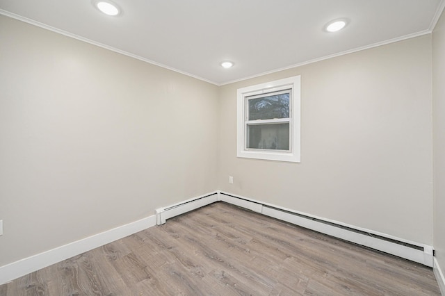 12 Barberry Ln, Middle Island, NY 11953 - spare room featuring wood finished floors, ornamental molding, recessed lighting, and baseboards