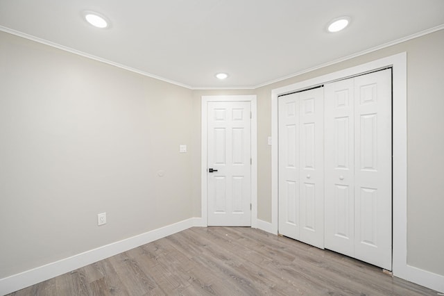 12 Barberry Ln, Middle Island, NY 11953 - unfurnished bedroom with baseboards, wood finished floors, crown molding, recessed lighting, and a closet