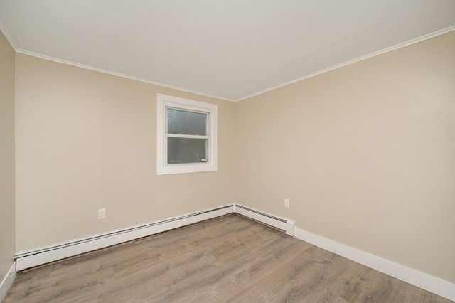 12 Barberry Ln, Middle Island, NY 11953 - spare room with wood finished floors, ornamental molding, baseboards, and baseboard heating