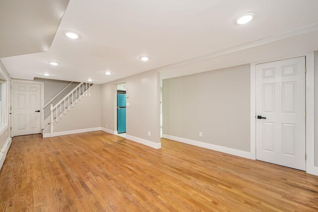 12 Barberry Ln, Middle Island, NY 11953 - finished basement with baseboards, stairway, light wood-type flooring, recessed lighting, and refrigerator