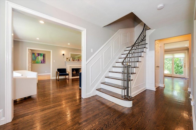 14 Pond Park Rd, Great Neck, NY 11023 - stairs with a fireplace, wood finished floors, ornamental molding, baseboards, and recessed lighting