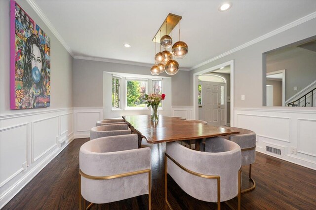 14 Pond Park Rd, Great Neck, NY 11023 - dining room featuring a decorative wall, dark wood-type flooring, wainscoting, crown molding, and stairway
