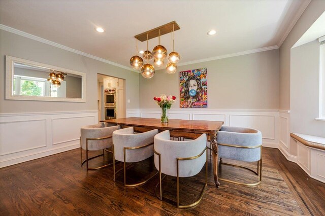 14 Pond Park Rd, Great Neck, NY 11023 - dining space with dark wood-style flooring, crown molding, a chandelier, a decorative wall, and a wainscoted wall