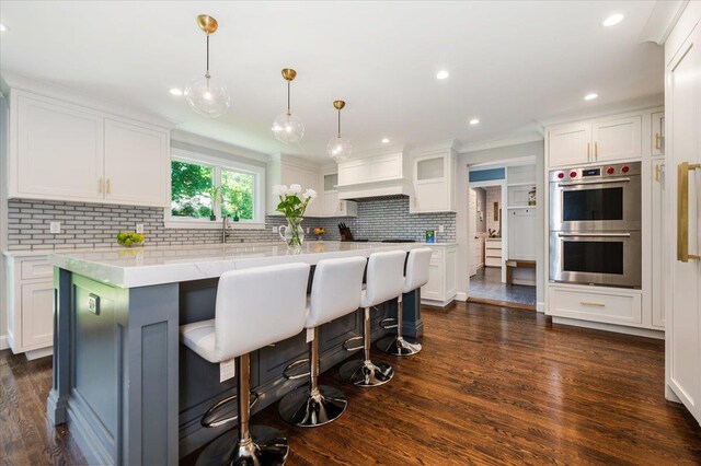 14 Pond Park Rd, Great Neck, NY 11023 - kitchen featuring stainless steel double oven, white cabinets, decorative backsplash, dark wood finished floors, and recessed lighting