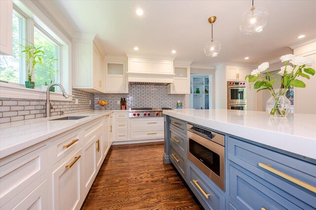 14 Pond Park Rd, Great Neck, NY 11023 - kitchen featuring a sink, appliances with stainless steel finishes, white cabinets, backsplash, and crown molding