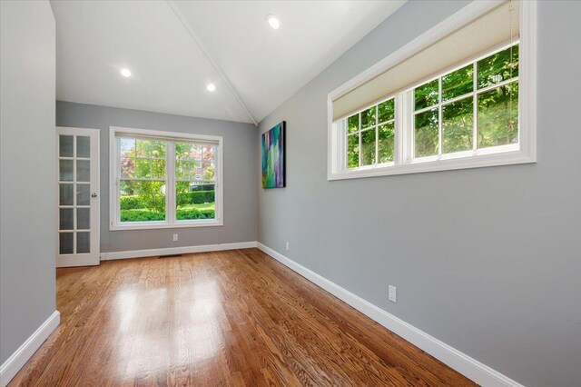 14 Pond Park Rd, Great Neck, NY 11023 - spare room with baseboards, wood finished floors, lofted ceiling, and recessed lighting