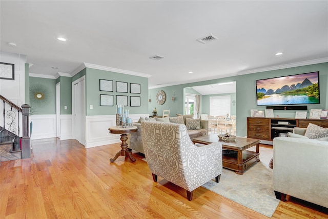 224 Biltmore Blvd, Massapequa, NY 11758 - living area featuring stairs, light wood-type flooring, crown molding, a wainscoted wall, and recessed lighting