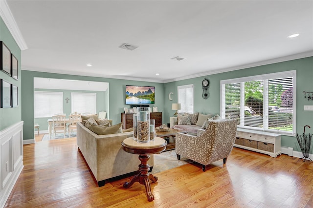 224 Biltmore Blvd, Massapequa, NY 11758 - living room featuring crown molding, plenty of natural light, light wood-style floors, recessed lighting, and baseboards