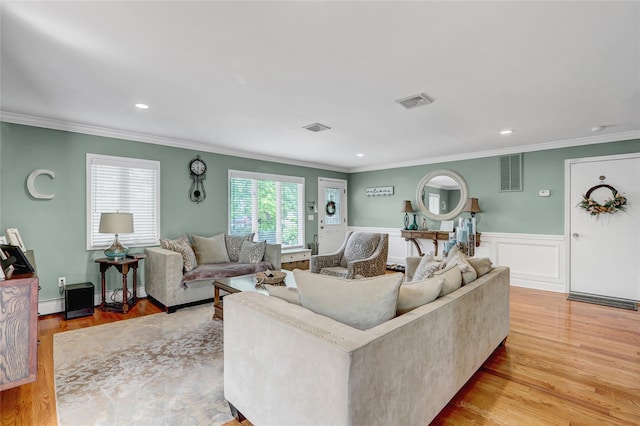 224 Biltmore Blvd, Massapequa, NY 11758 - living area featuring light wood-style floors, ornamental molding, a wainscoted wall, and recessed lighting
