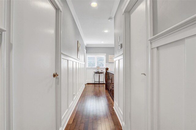224 Biltmore Blvd, Massapequa, NY 11758 - corridor featuring dark wood-style flooring, ornamental molding, a decorative wall, and recessed lighting