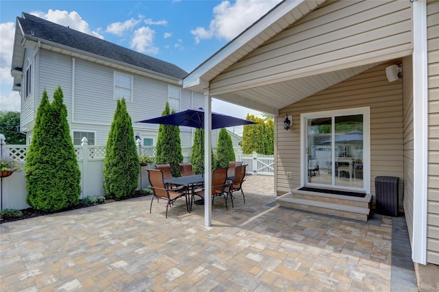 224 Biltmore Blvd, Massapequa, NY 11758 - fenced backyard featuring a patio, entry steps, outdoor dining space, and a gate