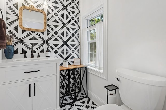 206 Brooksite Dr, Smithtown, NY 11787 - half bathroom with baseboards, vanity, toilet, and tile patterned floors