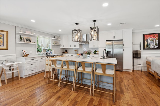 206 Brooksite Dr, Smithtown, NY 11787 - kitchen featuring stainless steel fridge, open shelves, ornamental molding, light countertops, and white cabinets