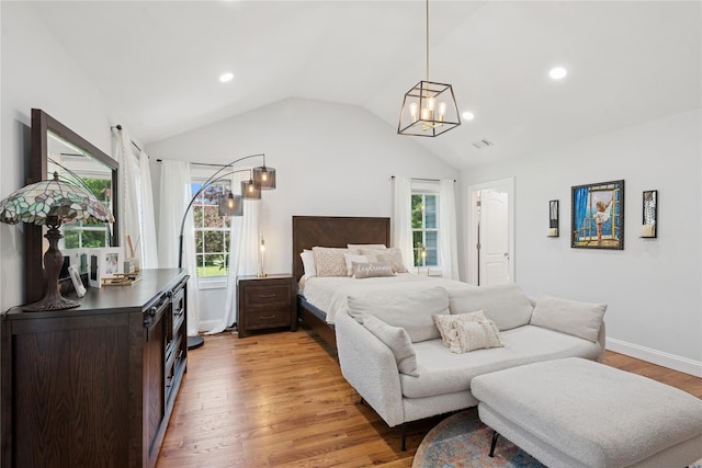206 Brooksite Dr, Smithtown, NY 11787 - bedroom with multiple windows, vaulted ceiling, a chandelier, light wood-style floors, and baseboards