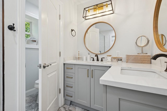 206 Brooksite Dr, Smithtown, NY 11787 - bathroom featuring marble look tiles, double vanity, and toilet