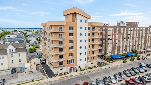 661 W Broadway Unit 203, Long Beach, NY 11561 - view of apartment building / complex featuring uncovered parking