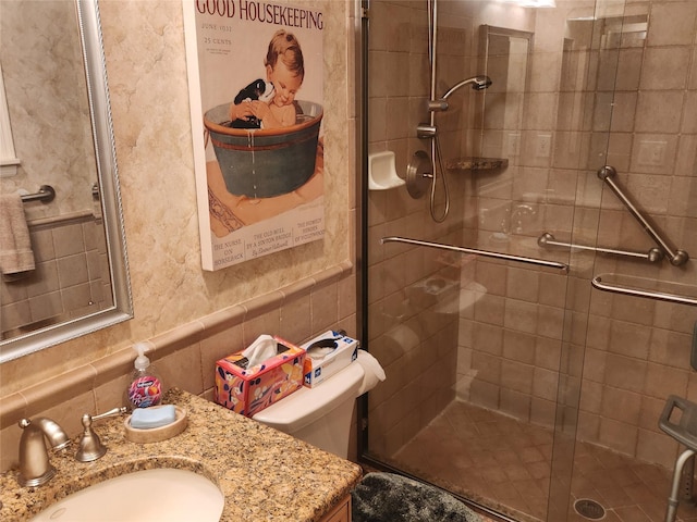 166 Southgate Cir, Massapequa Park, NY 11762 - full bathroom featuring vanity, a shower stall, tile walls, and toilet
