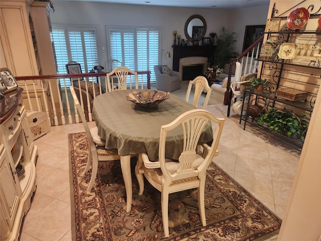 166 Southgate Cir, Massapequa Park, NY 11762 - dining area featuring light tile patterned floors and a fireplace