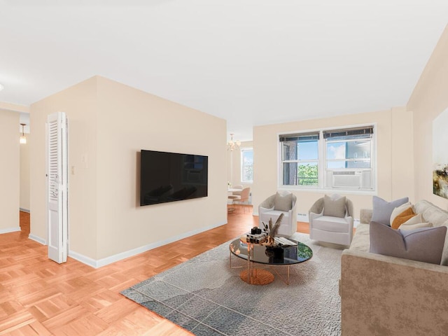 5550 Fieldston Rd Unit 8D, Bronx, NY 10471 - living room with baseboards, a chandelier, and cooling unit