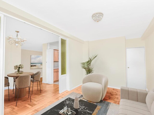 5550 Fieldston Rd Unit 8D, Bronx, NY 10471 - living area featuring a chandelier and baseboards