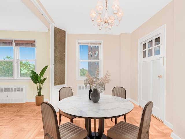 5550 Fieldston Rd Unit 8D, Bronx, NY 10471 - dining area featuring radiator heating unit, a chandelier, plenty of natural light, and baseboards