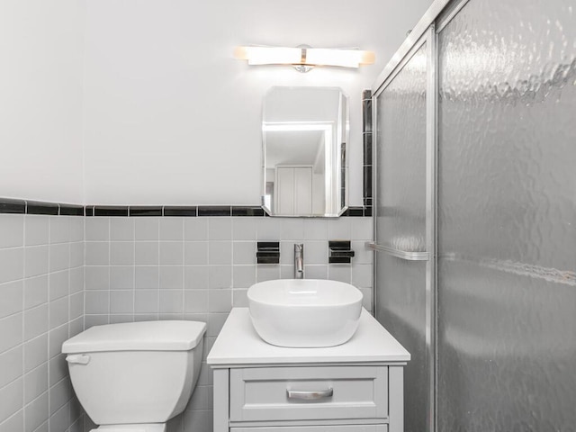 5550 Fieldston Rd Unit 8D, Bronx, NY 10471 - full bath featuring tile walls, vanity, a stall shower, and toilet