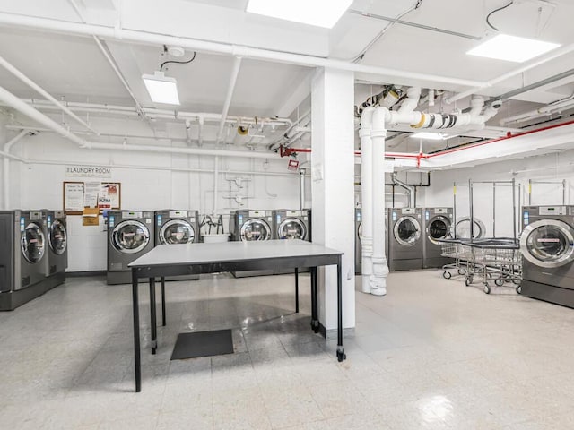5550 Fieldston Rd Unit 8D, Bronx, NY 10471 - miscellaneous room featuring washer and dryer and tile patterned floors