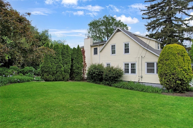 26 Van Nostrand Pl, Nanuet, NY 10954 - view of side of property with a chimney and a yard