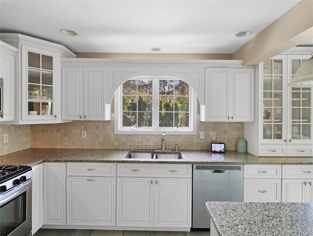 26 Van Nostrand Pl, Nanuet, NY 10954 - kitchen featuring stainless steel appliances, a sink, white cabinetry, and backsplash
