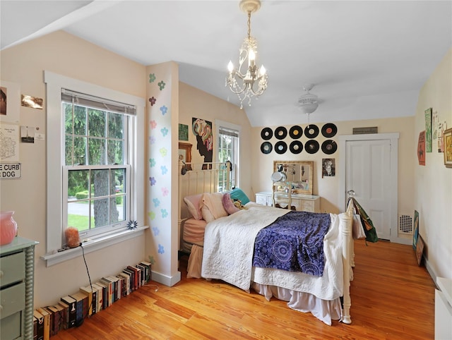 26 Van Nostrand Pl, Nanuet, NY 10954 - bedroom featuring light wood-style flooring, a chandelier, baseboards, and vaulted ceiling