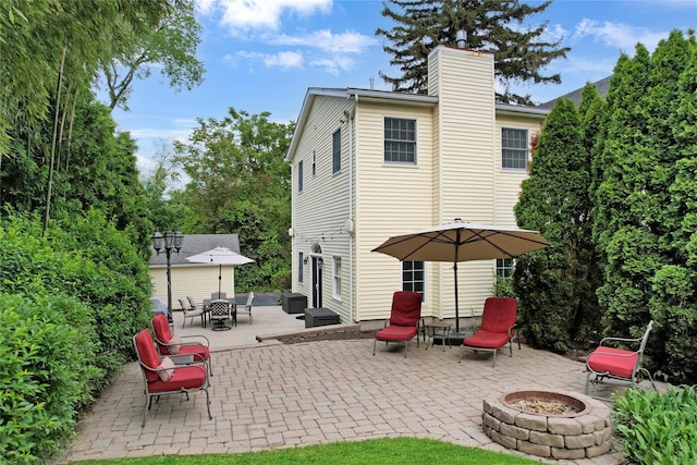 26 Van Nostrand Pl, Nanuet, NY 10954 - back of house with an outdoor fire pit, a chimney, and a patio