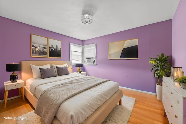 160 Laconia Ave, Staten Island, NY 10305 - bedroom with wood finished floors, baseboards, and cooling unit