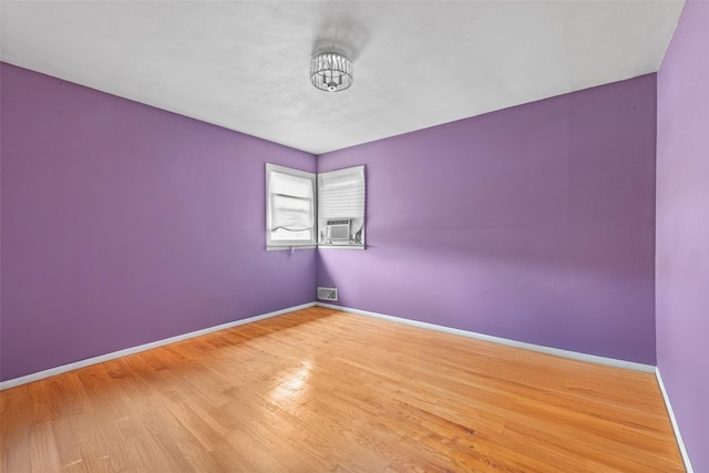 160 Laconia Ave, Staten Island, NY 10305 - unfurnished room featuring wood finished floors, baseboards, and cooling unit