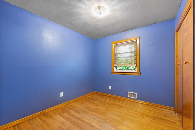160 Laconia Ave, Staten Island, NY 10305 - empty room featuring wood finished floors, baseboards, and a textured ceiling