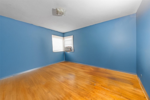 160 Laconia Ave, Staten Island, NY 10305 - empty room featuring wood finished floors, baseboards, and cooling unit