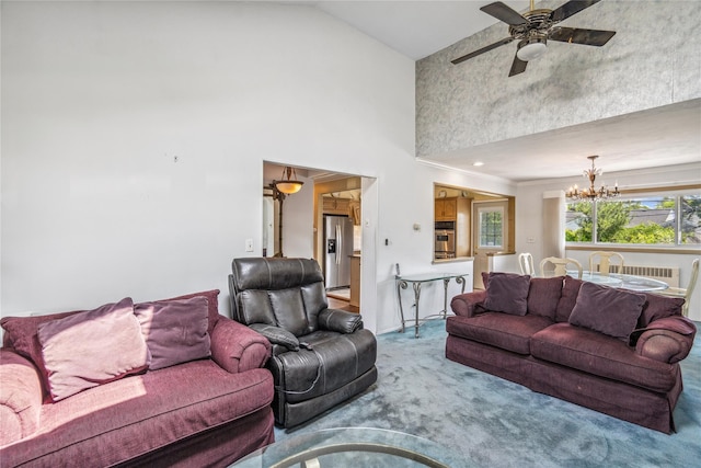 697 Byron Ave, Franklin Square, NY 11010 - living room featuring high vaulted ceiling, carpet, a chandelier, and ceiling fan