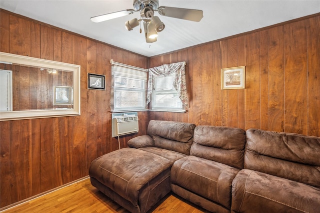 697 Byron Ave, Franklin Square, NY 11010 - living area with wooden walls, wood finished floors, a ceiling fan, and cooling unit
