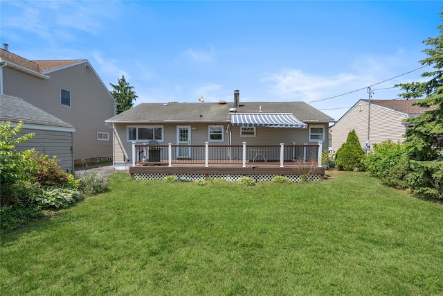 697 Byron Ave, Franklin Square, NY 11010 - rear view of property featuring a wooden deck, a lawn, and roof with shingles