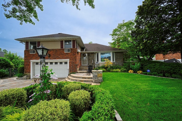 613 Gary Pl, Westbury, NY 11590 - tri-level home featuring an attached garage, a front yard, driveway, stone siding, and brick siding
