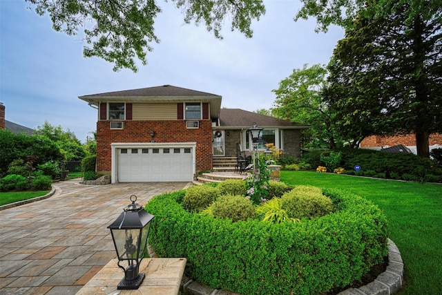 613 Gary Pl, Westbury, NY 11590 - tri-level home with an attached garage, driveway, brick siding, and a front yard