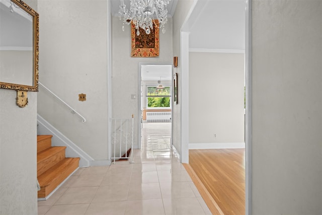 613 Gary Pl, Westbury, NY 11590 - entryway featuring a chandelier, tile patterned floors, stairway, and baseboards