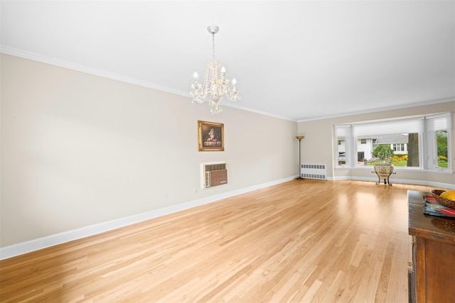 613 Gary Pl, Westbury, NY 11590 - living area with radiator, crown molding, light wood-style flooring, a chandelier, and baseboards