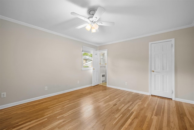 613 Gary Pl, Westbury, NY 11590 - unfurnished room featuring crown molding, baseboards, light wood finished floors, and a ceiling fan