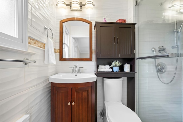 613 Gary Pl, Westbury, NY 11590 - full bathroom with a shower stall, tile walls, vanity, and toilet
