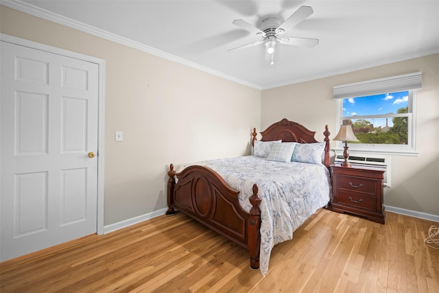613 Gary Pl, Westbury, NY 11590 - bedroom with light wood-type flooring, baseboards, crown molding, and a ceiling fan