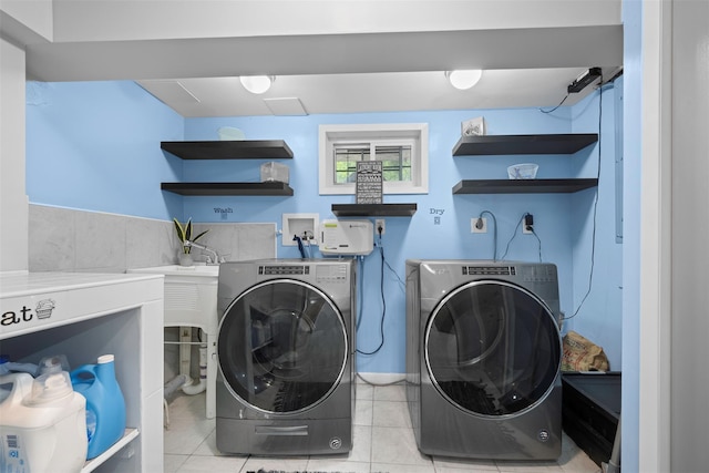 613 Gary Pl, Westbury, NY 11590 - laundry room featuring washing machine and clothes dryer and light tile patterned flooring