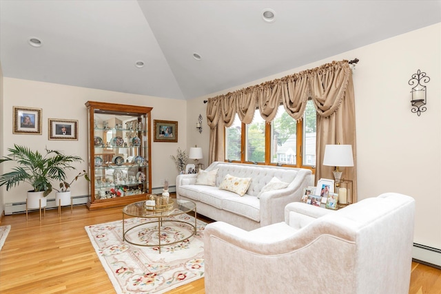 314 Oakview Ave, Oceanside, NY 11572 - living room with a baseboard heating unit, light wood-style flooring, recessed lighting, and high vaulted ceiling